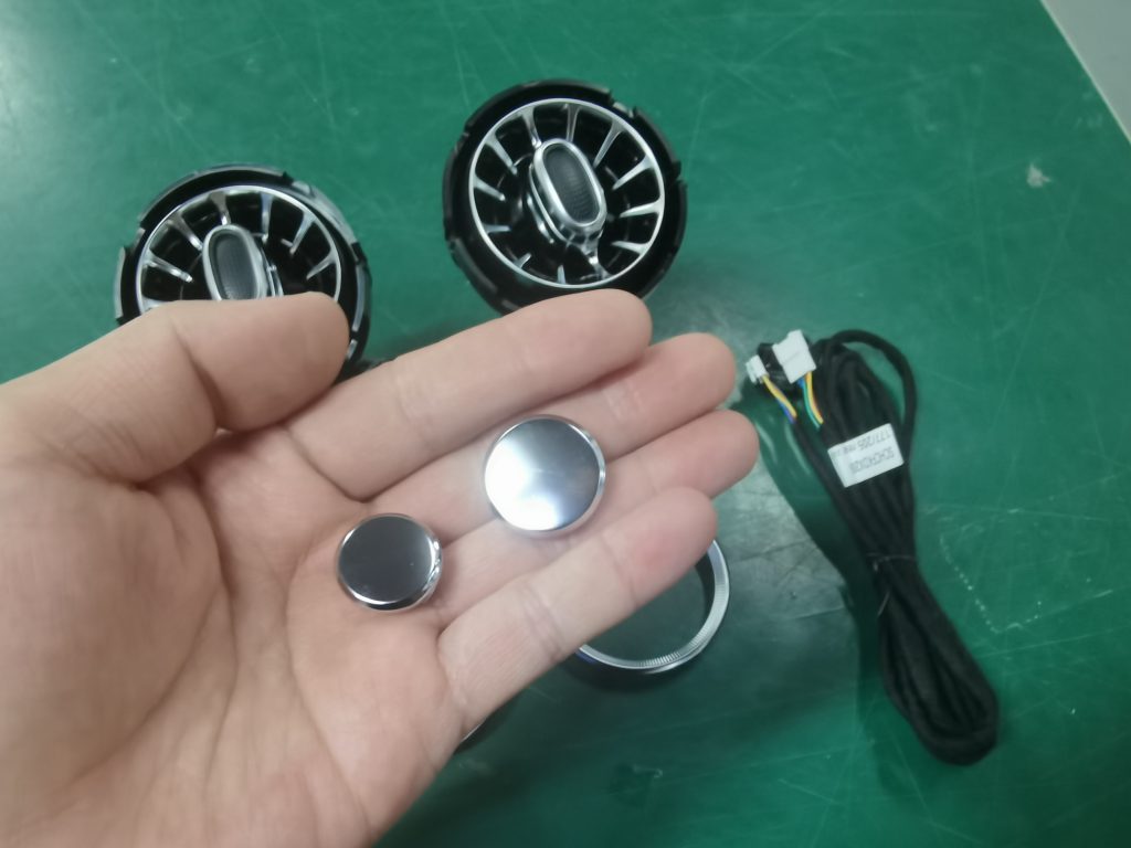 Rear vent blanking caps beside the replacement vents and harness
