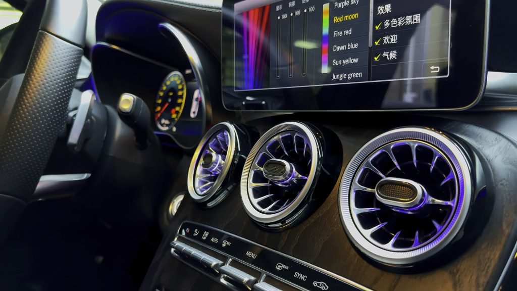 Three illuminated centre vents installed in a W205 dashboard. Still from the CKCP cabin showcase at 4.200 seconds. Other cabin lighting shown is separate.